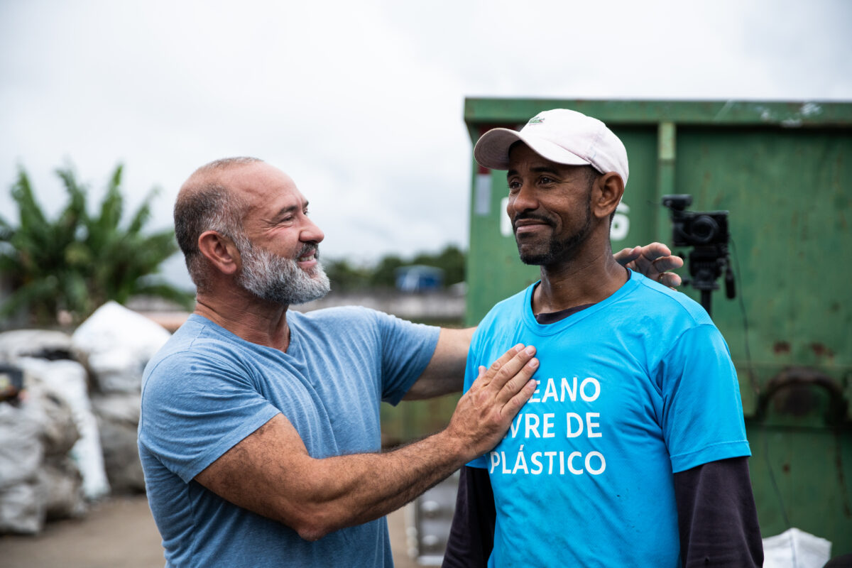 What can hand-gathering 100 million kilograms of discarded plastic achieve?