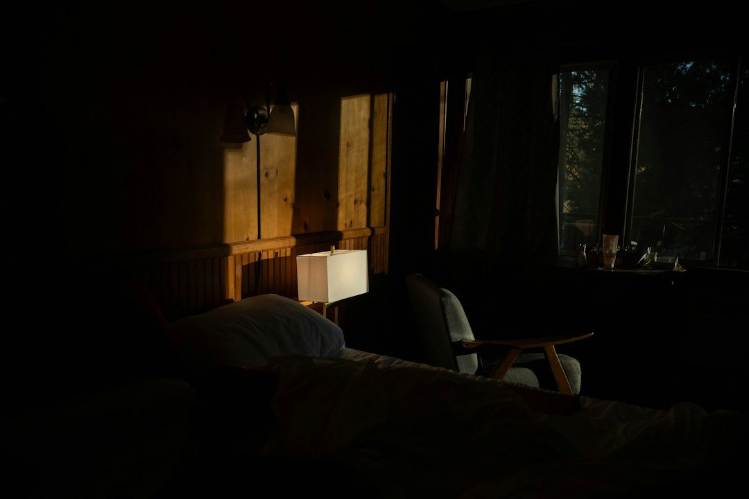 Morning sunlight streaming into a bedroom, which helps reset sleep timing for better mental health